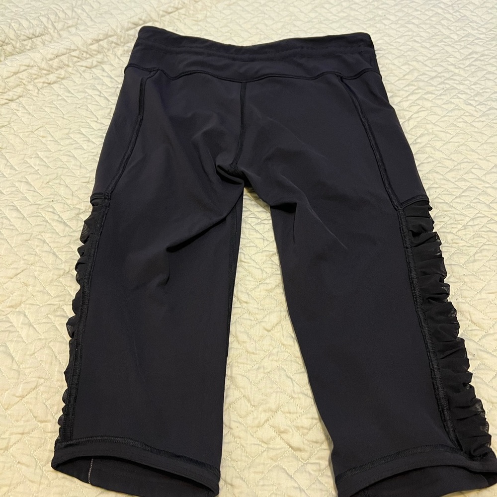 Lululemon athletica Black Capri leggings with Ruffle Detail size 8